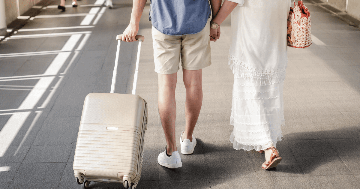 couple walking with luggage on the way to bohol